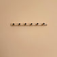 Versatile Wooden Peg Rail for Display & Storage
